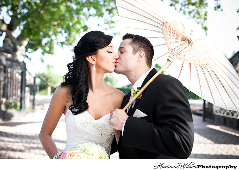 bride and groom with parasol