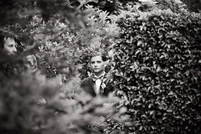 Groom waiting for ceremony photo