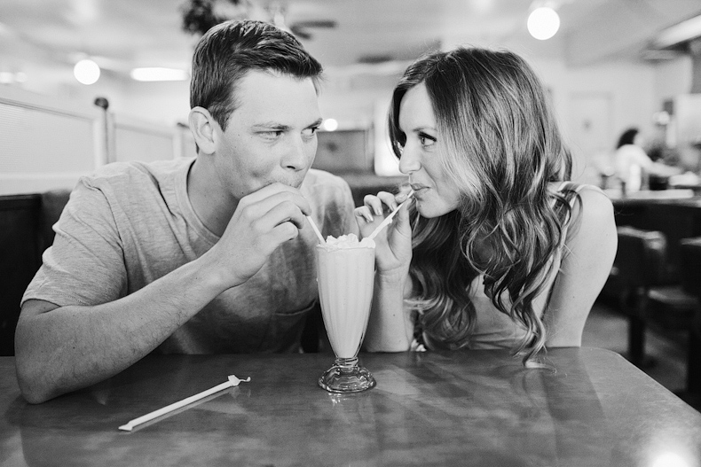 sharing a milkshake at engagement session