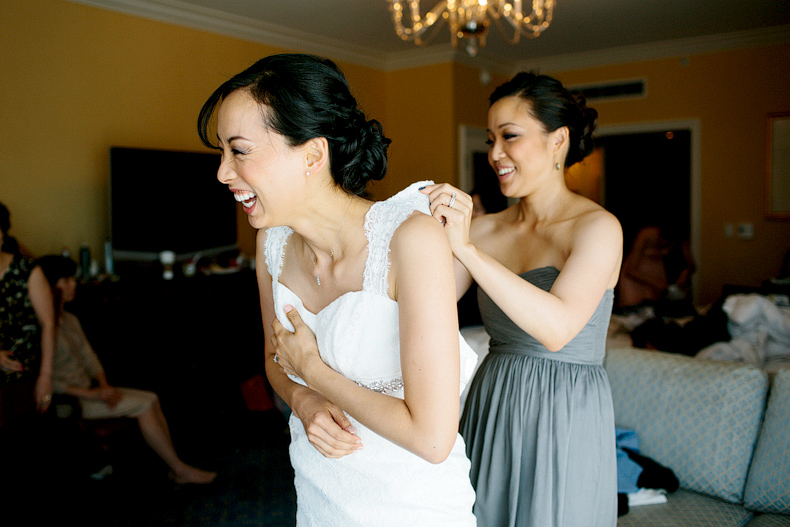 This is the bride putting on her dress at the Hyatt in Westlake Village.