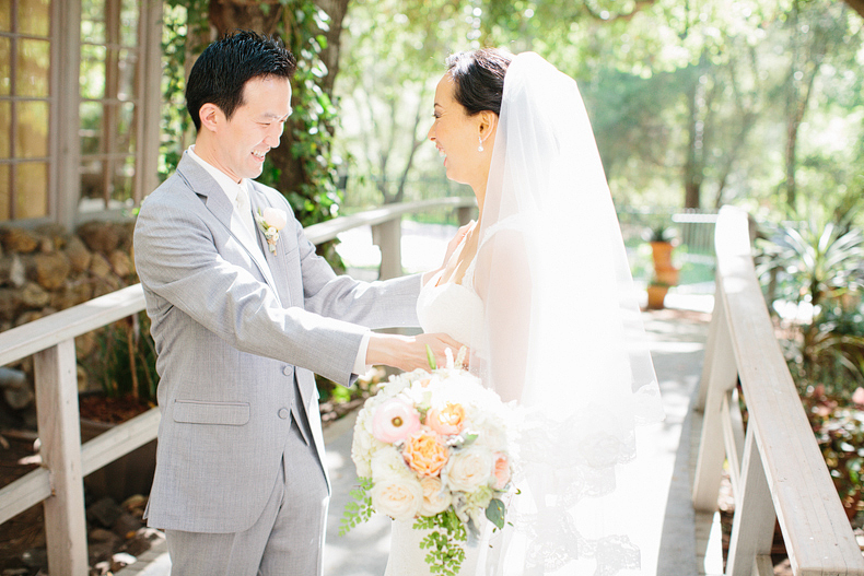 This is a photo of the bride and groom first look on a bridge.