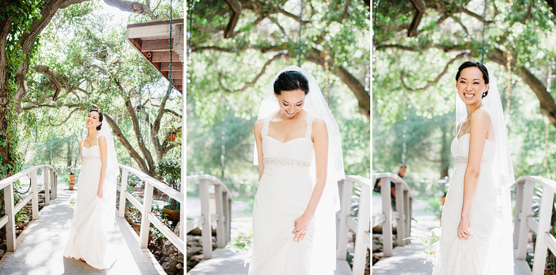 This is a photo of the bride looking beautiful on a bridge with trees in the background.