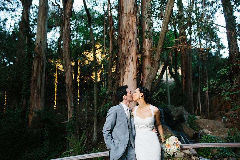 This is a bride and groom photo on a bridge.