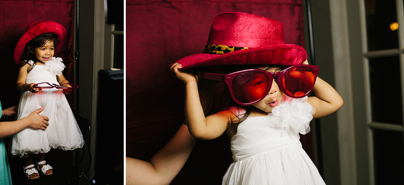 This is a super adorable little girl in a photobooth.