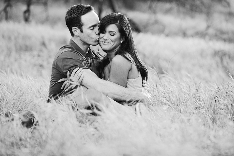 black and white photo of a couple in a field