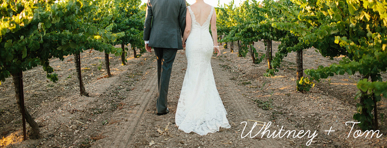 This is a photo of the bride and groom walking at their Firestone Vineyard wedding.