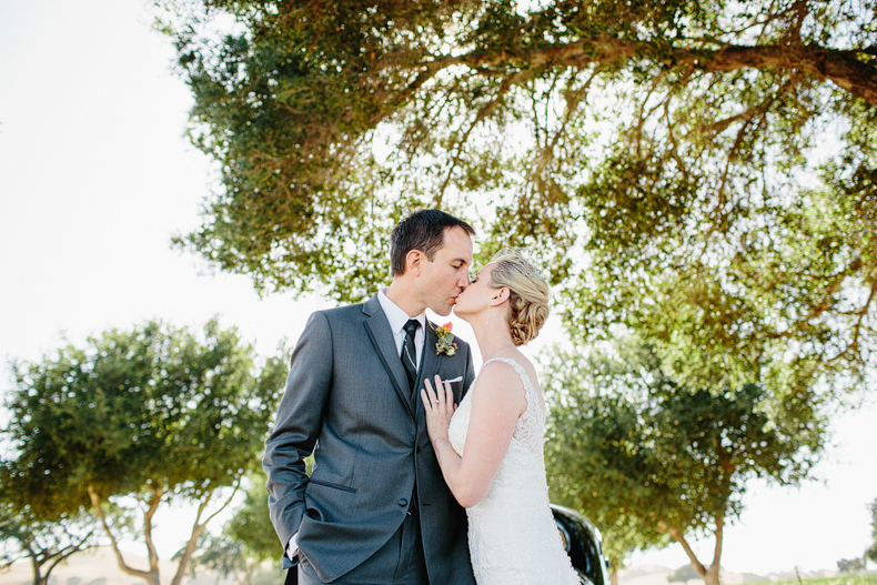 This is a bride and groom kissing photo.