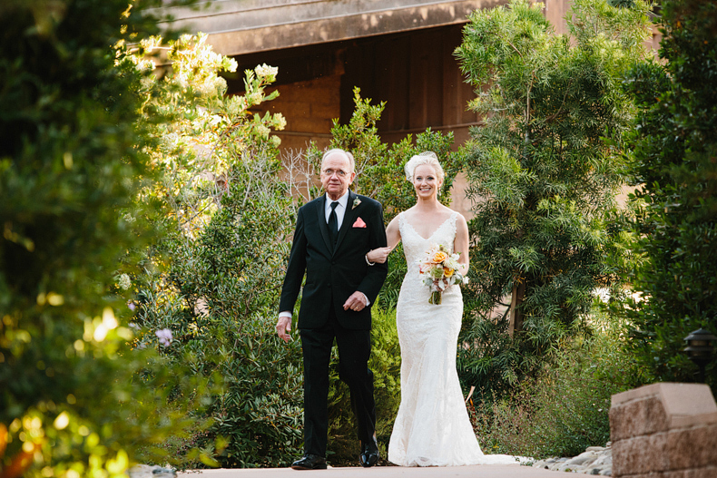 The bride and her dad walking down the aisle at her Firestone Vineyard wedding.