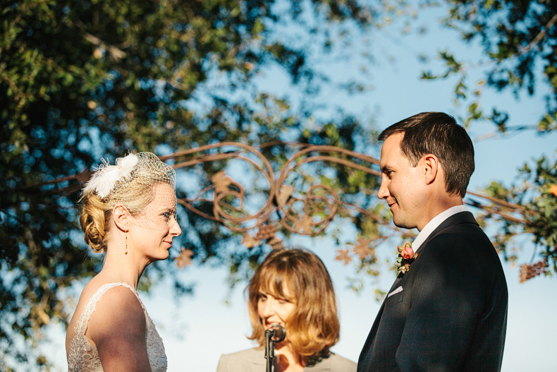 This is a photo of the bride and groom during their Firestone Vineyard wedding ceremony.