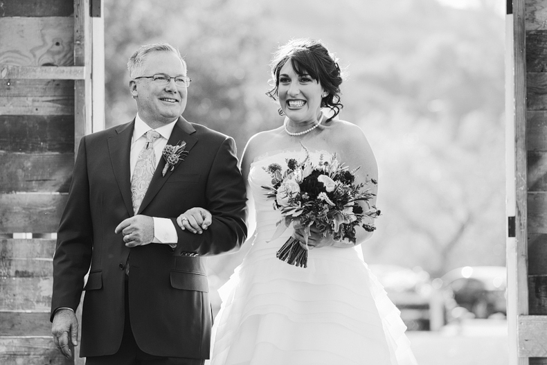 Abigail being walked down the aisle by her father. 