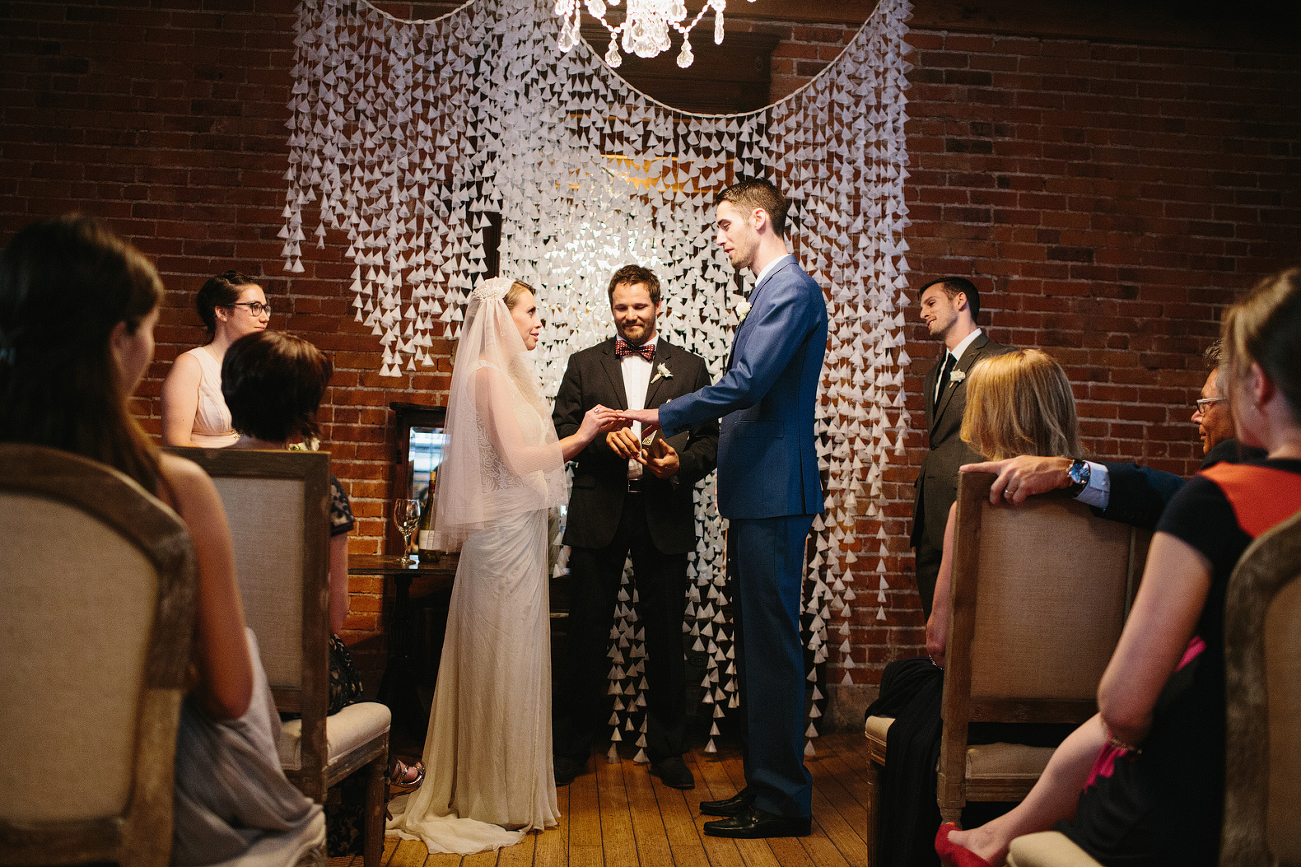 This is a photo of Alannah and Evan exchanging rings.