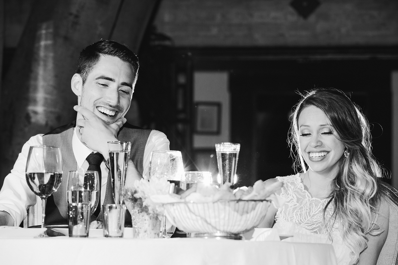 Alannah and Evan are laughing at the best man at their Carondelet House wedding.