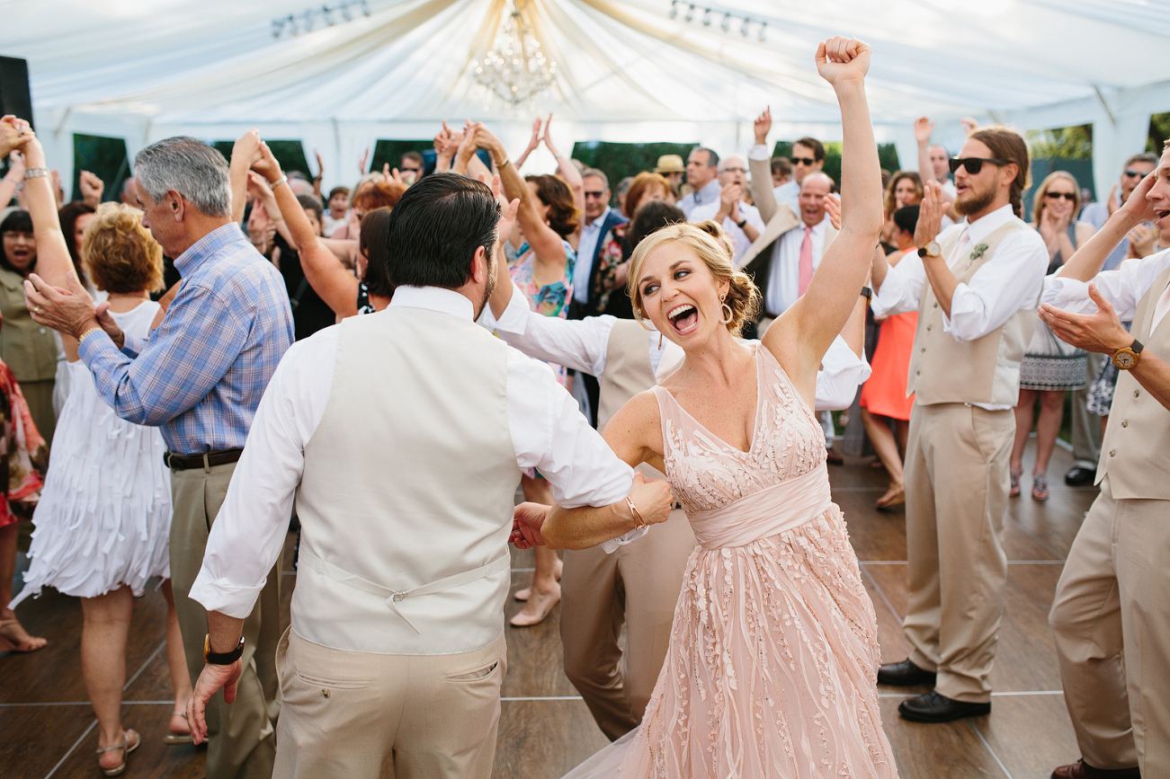 Jess cutting the rug with one of the groomsmen.