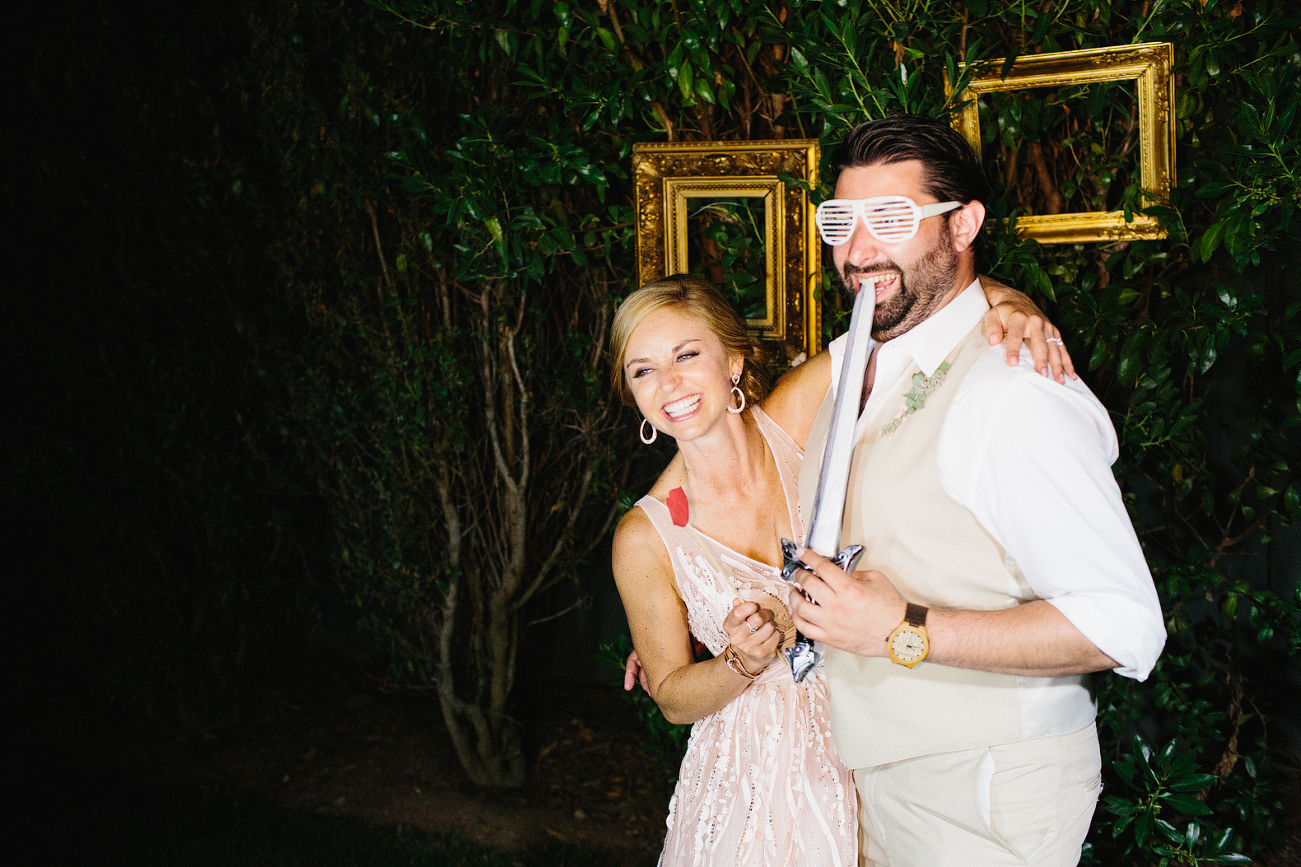 This is a photo of Jess and one of the groomsmen enjoying the photo booth.