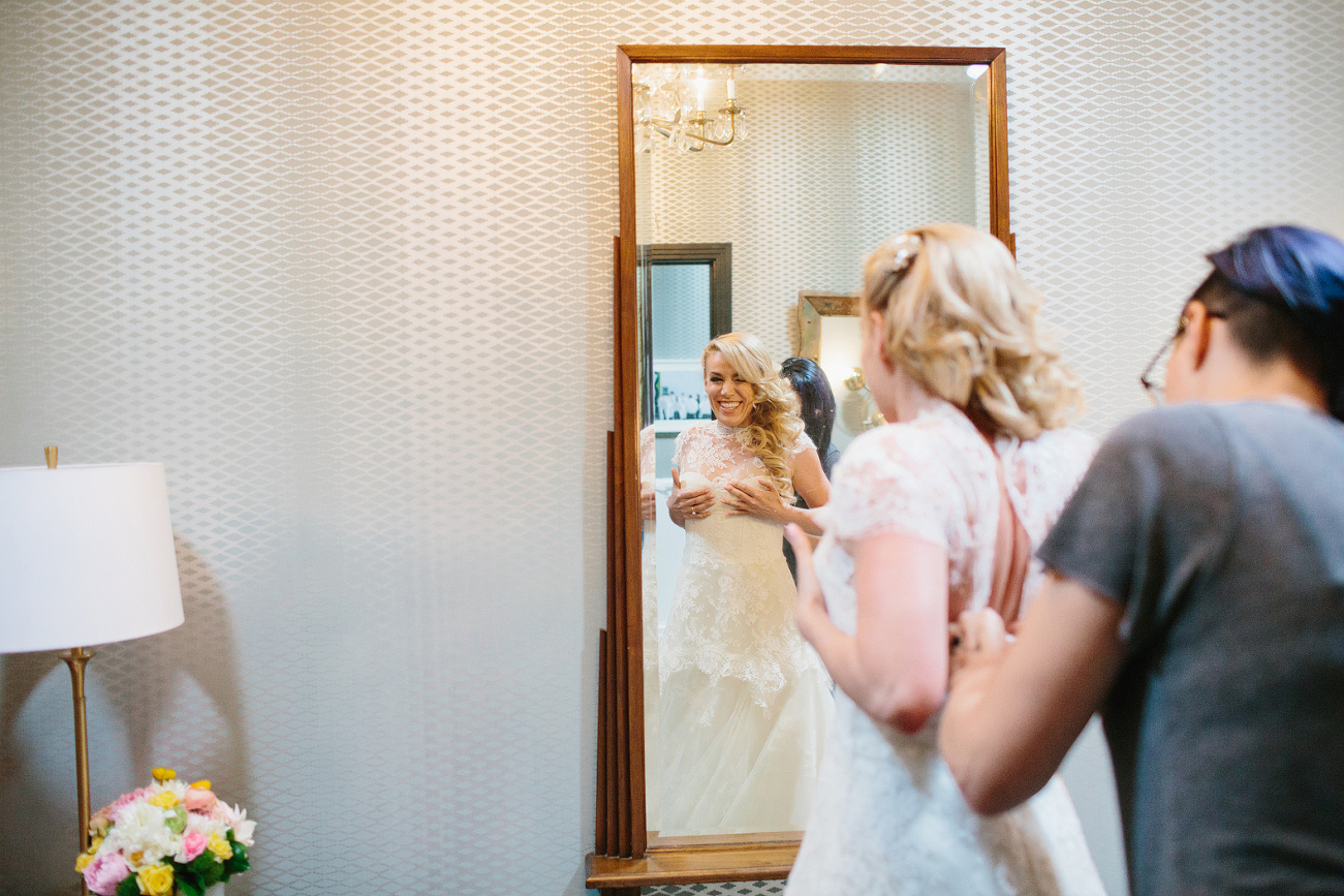 This is a photo of Sasha putting on her dress.