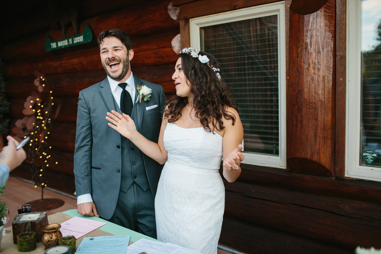 This is Jenn and Jon laughing and joking during the signing of the marriage license.