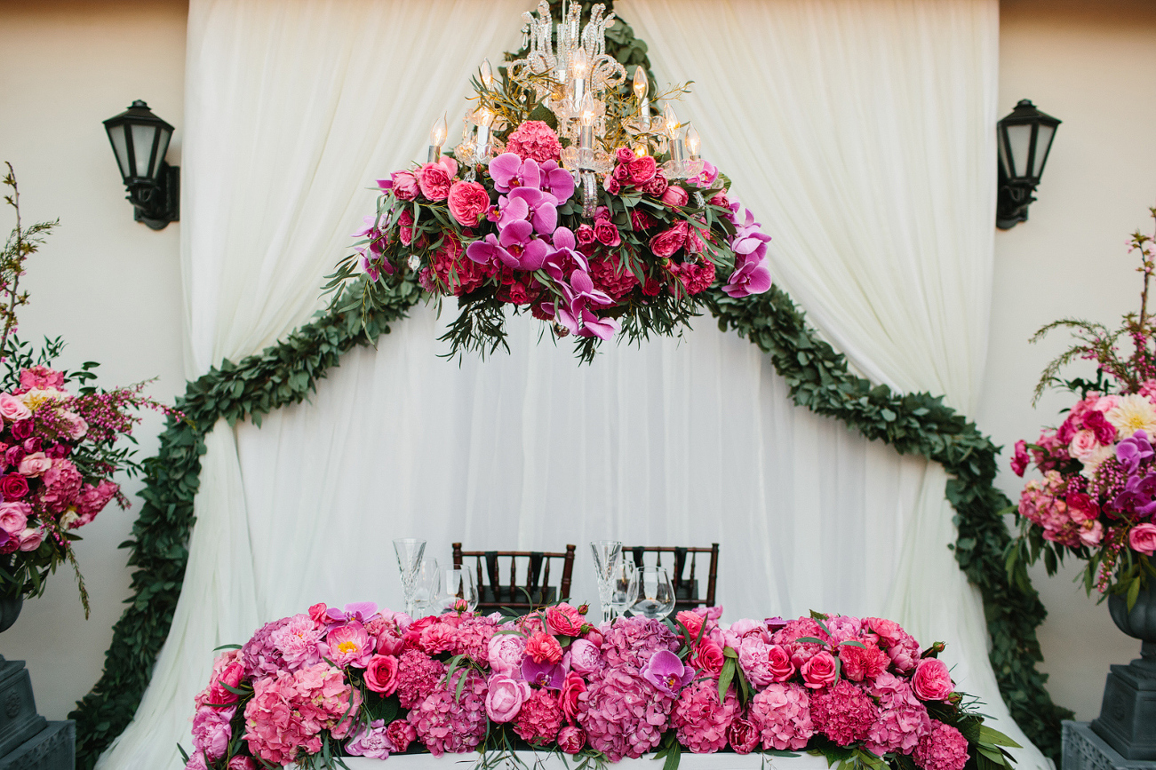 You could barely see the head table because there were so many gorgeous flowers.