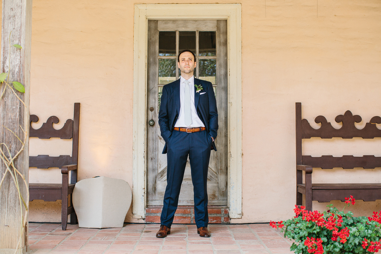 The groom outside at the museum.