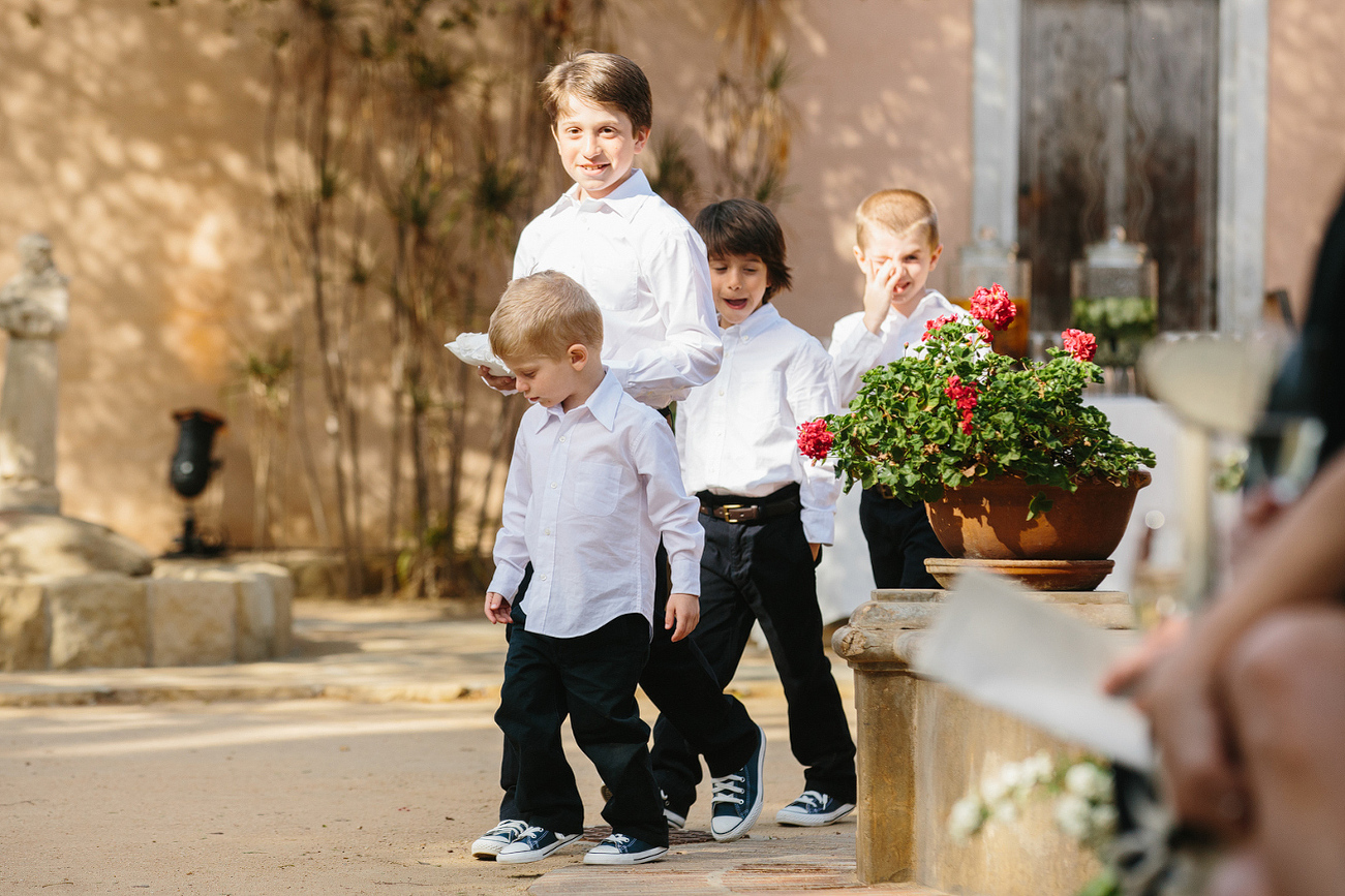 The ring bearers walking down the aisle.