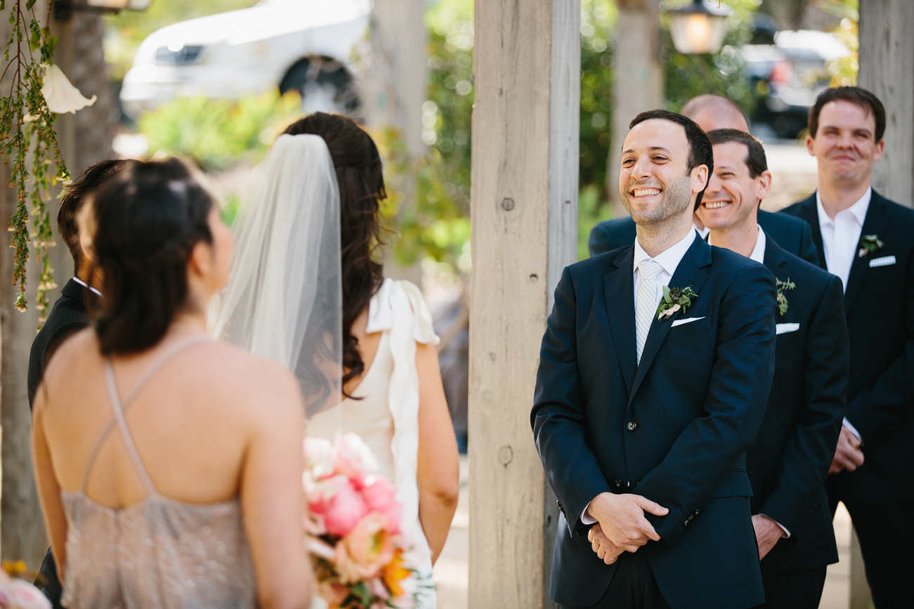 Andrew looking at Katy and smiling during the ceremony. 