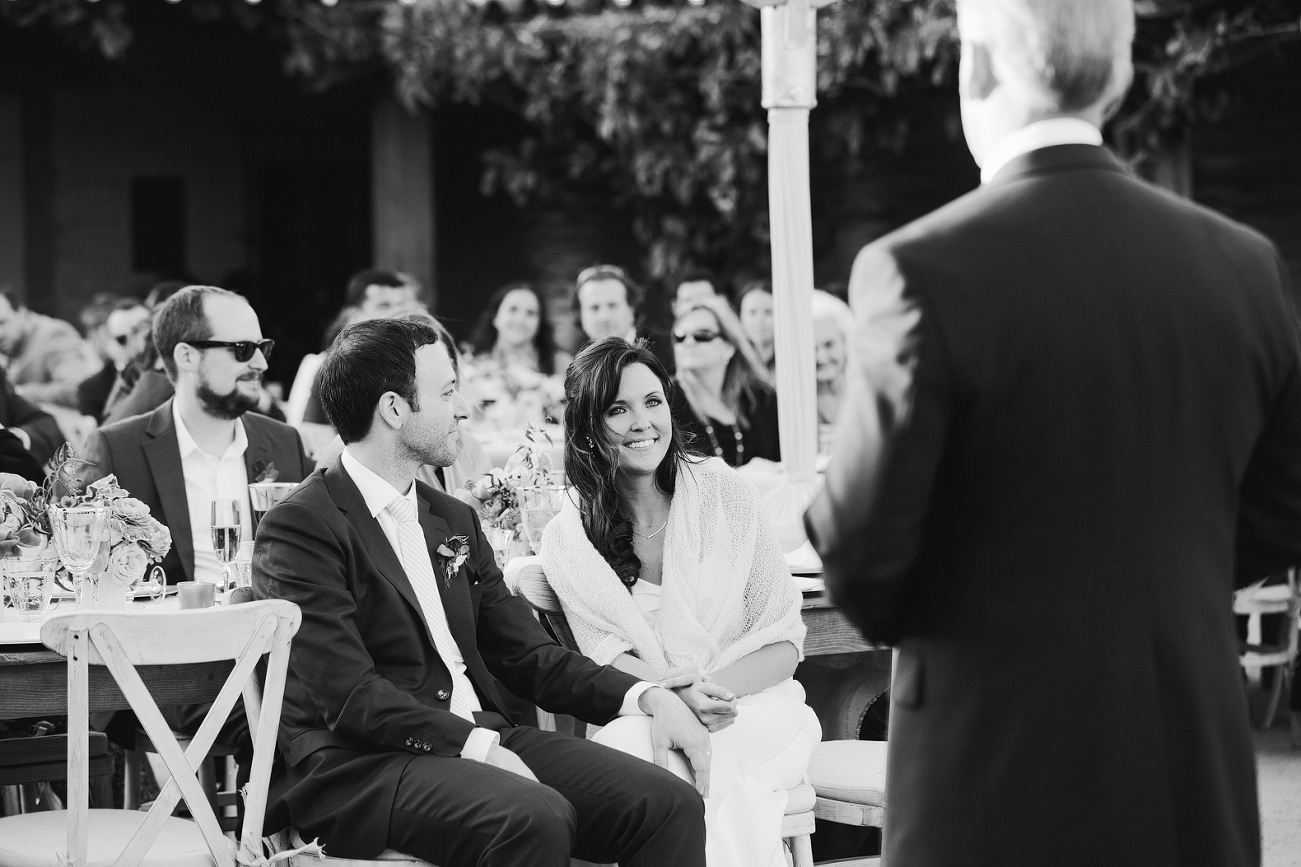 Katy watching her father give a welcome speech. 