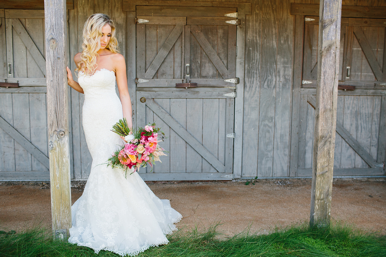 Here is a beautiful photo of the bride in front of the barn. 