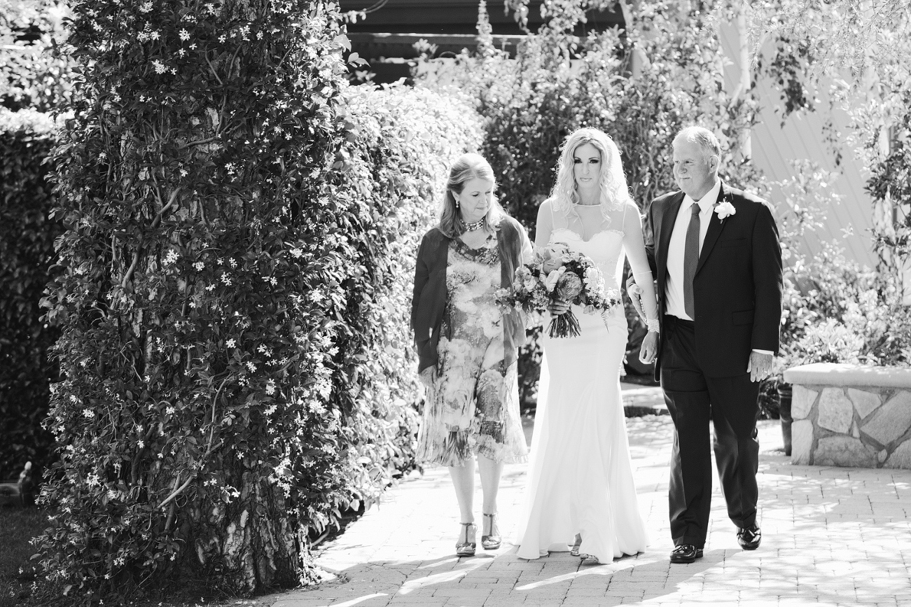 Here is a photo of the bride and her parents right before she walked down the aisle. 