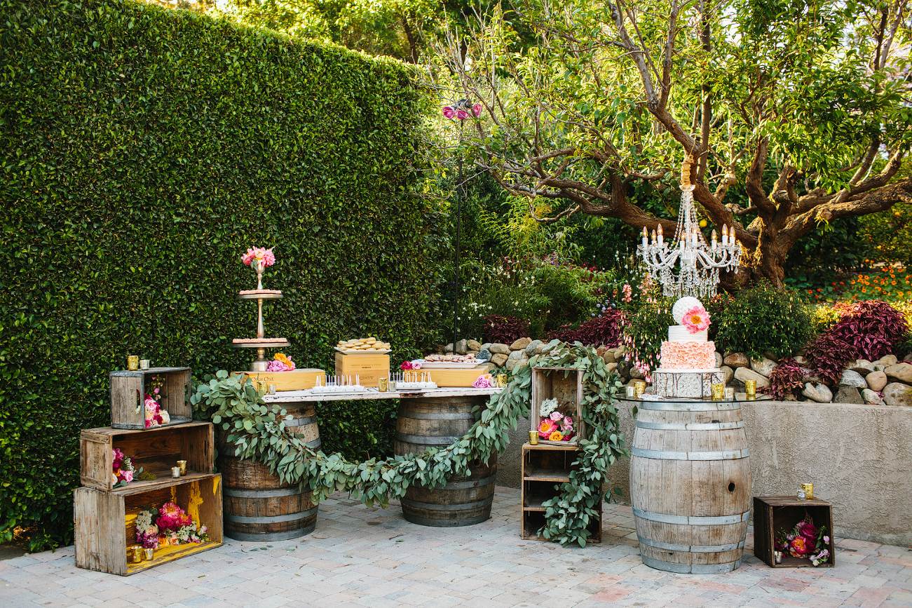 The couple had a dessert bar on wine barrels. 