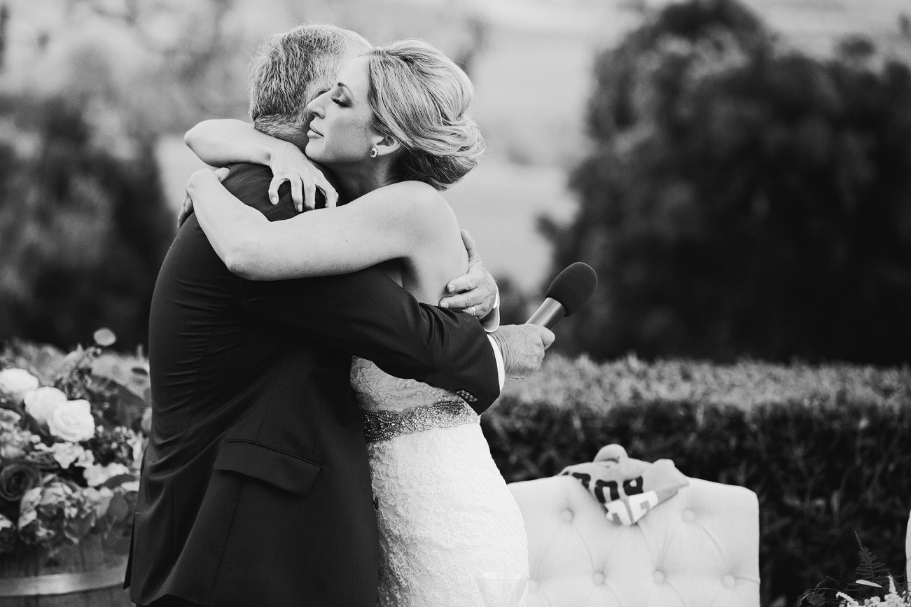 Here is a photo of the bride hugging her dad. 