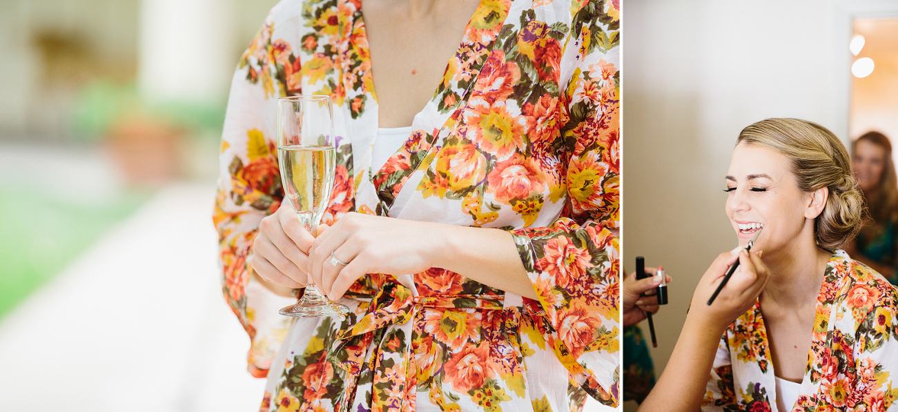 The bride wore a bright colorful floral robe during getting ready.