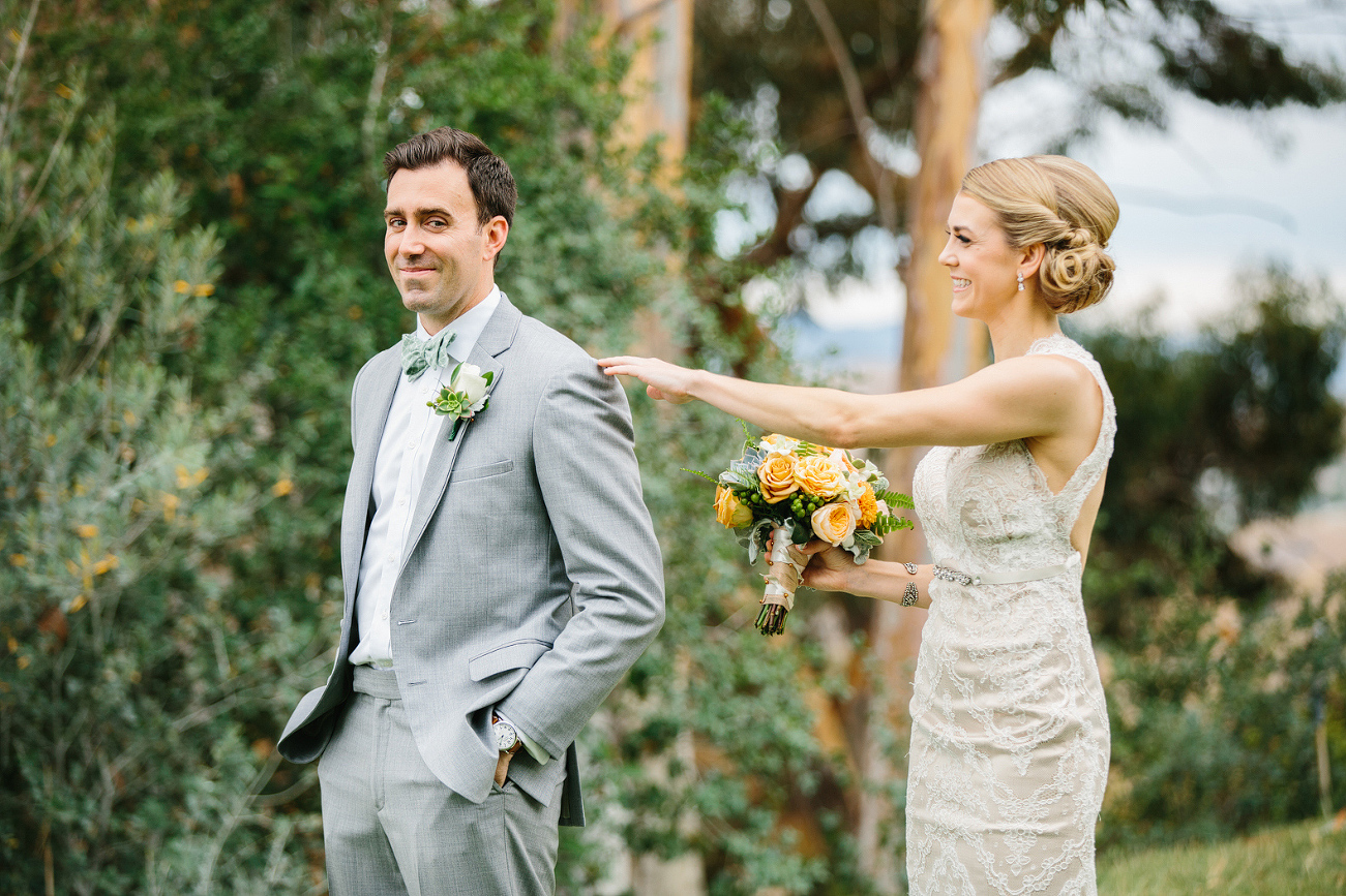 This is a photo of the bride and groom during the first look. 