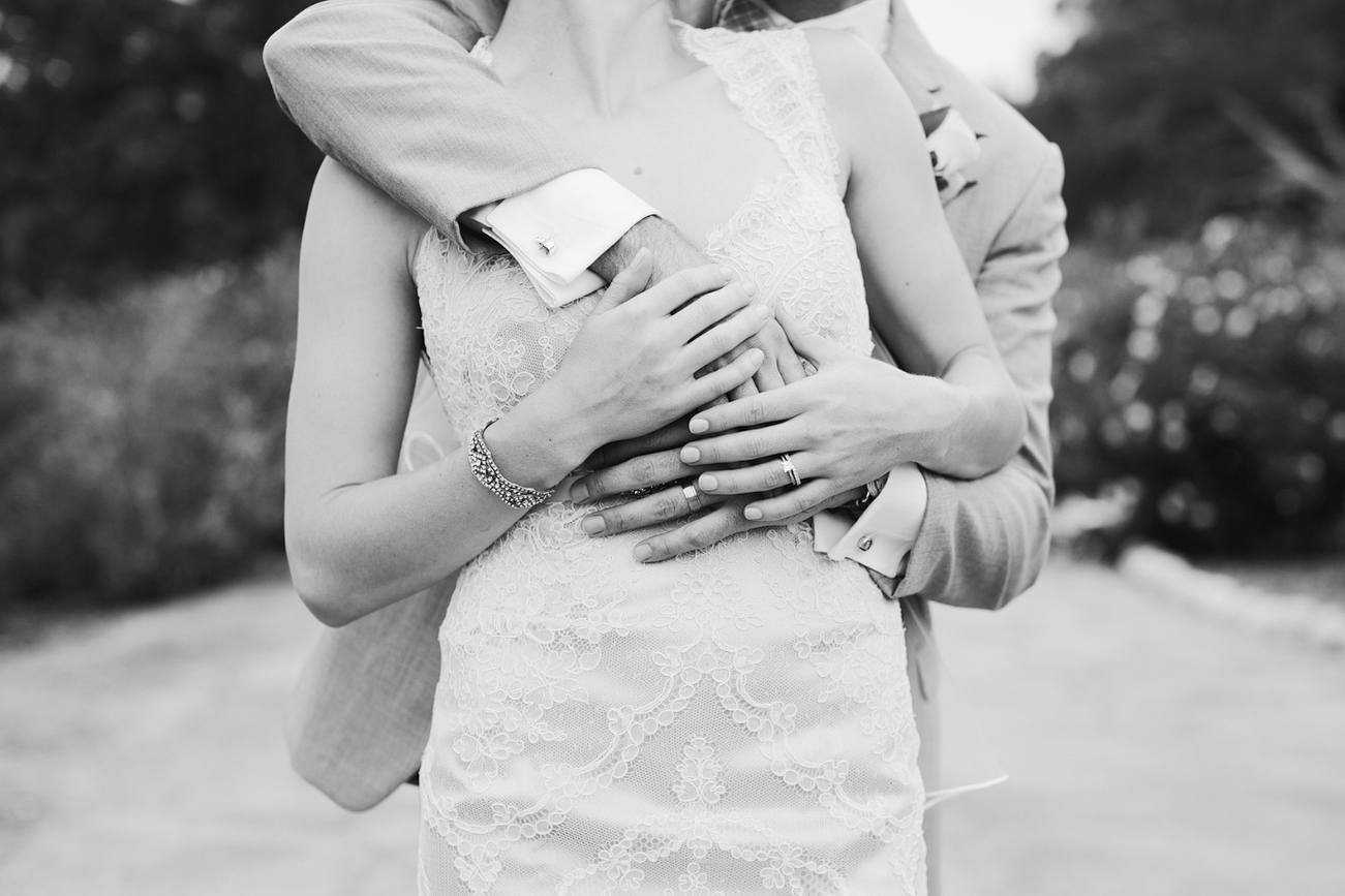 This is a cute photo of the groom hugging the bride. 