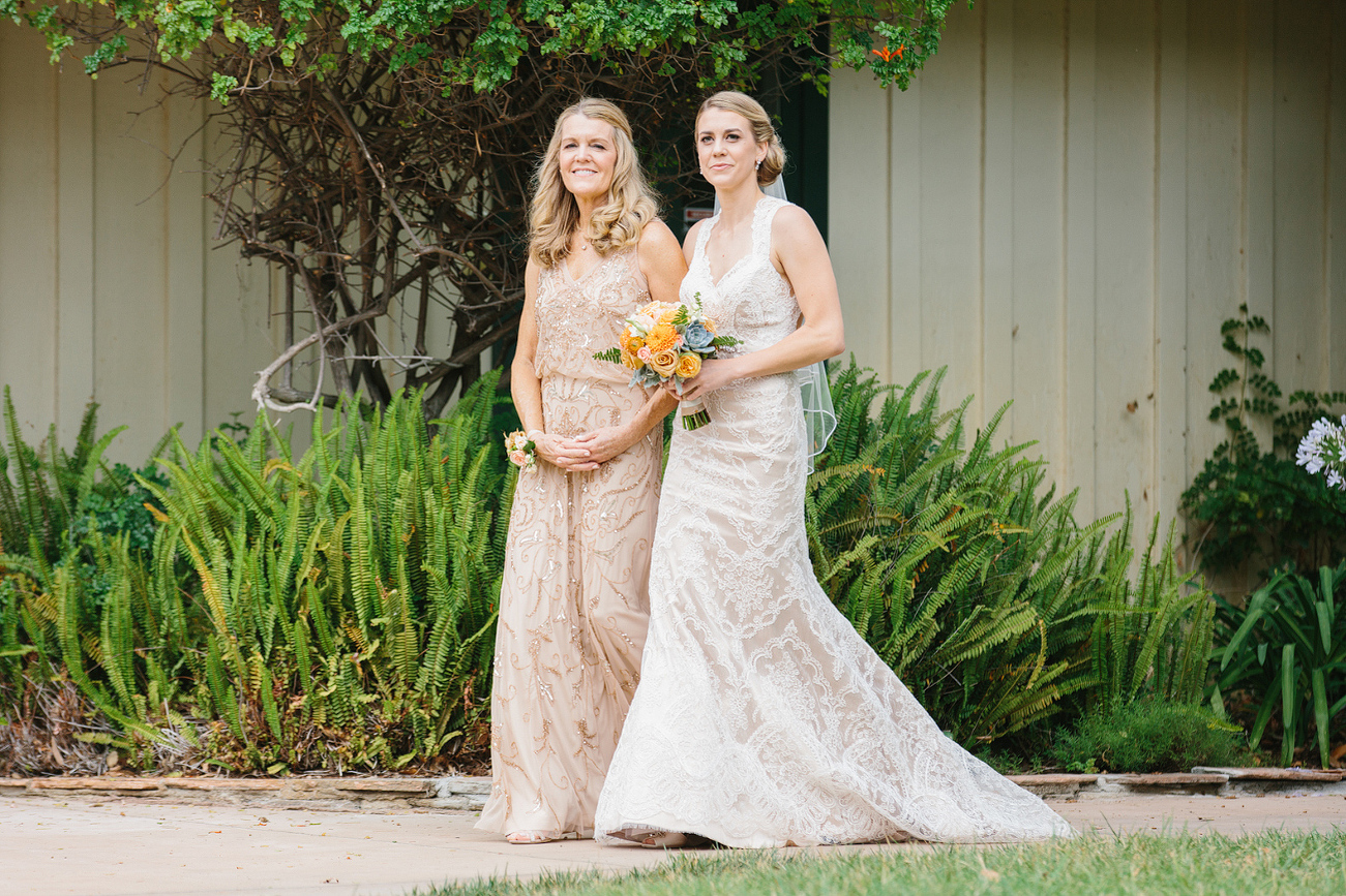 The mother of the bride walked Kelly down the aisle. 