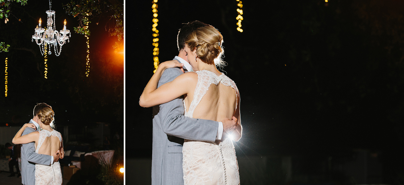 The couple danced under a chandelier. 