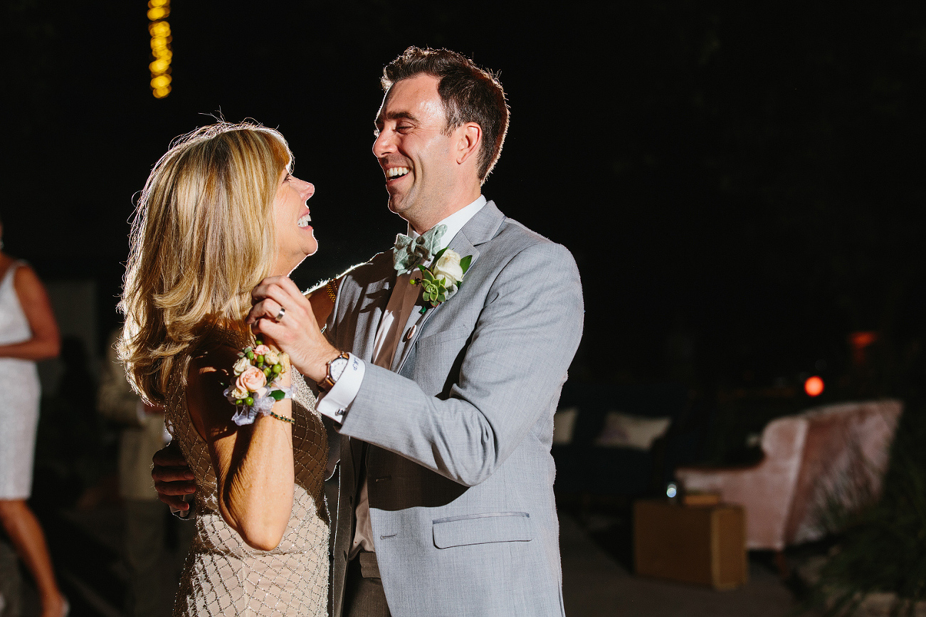 The mother and son dance during the wedding reception. 