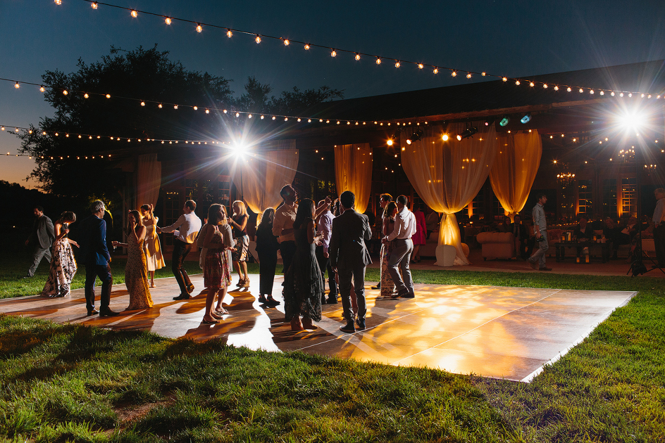 A photo of guests dancing during the reception. 