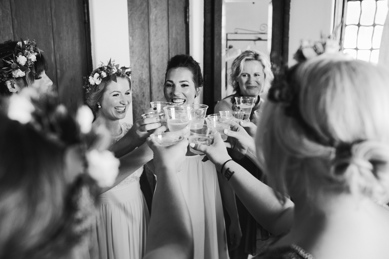 Emily and the bridesmaids toasting. 