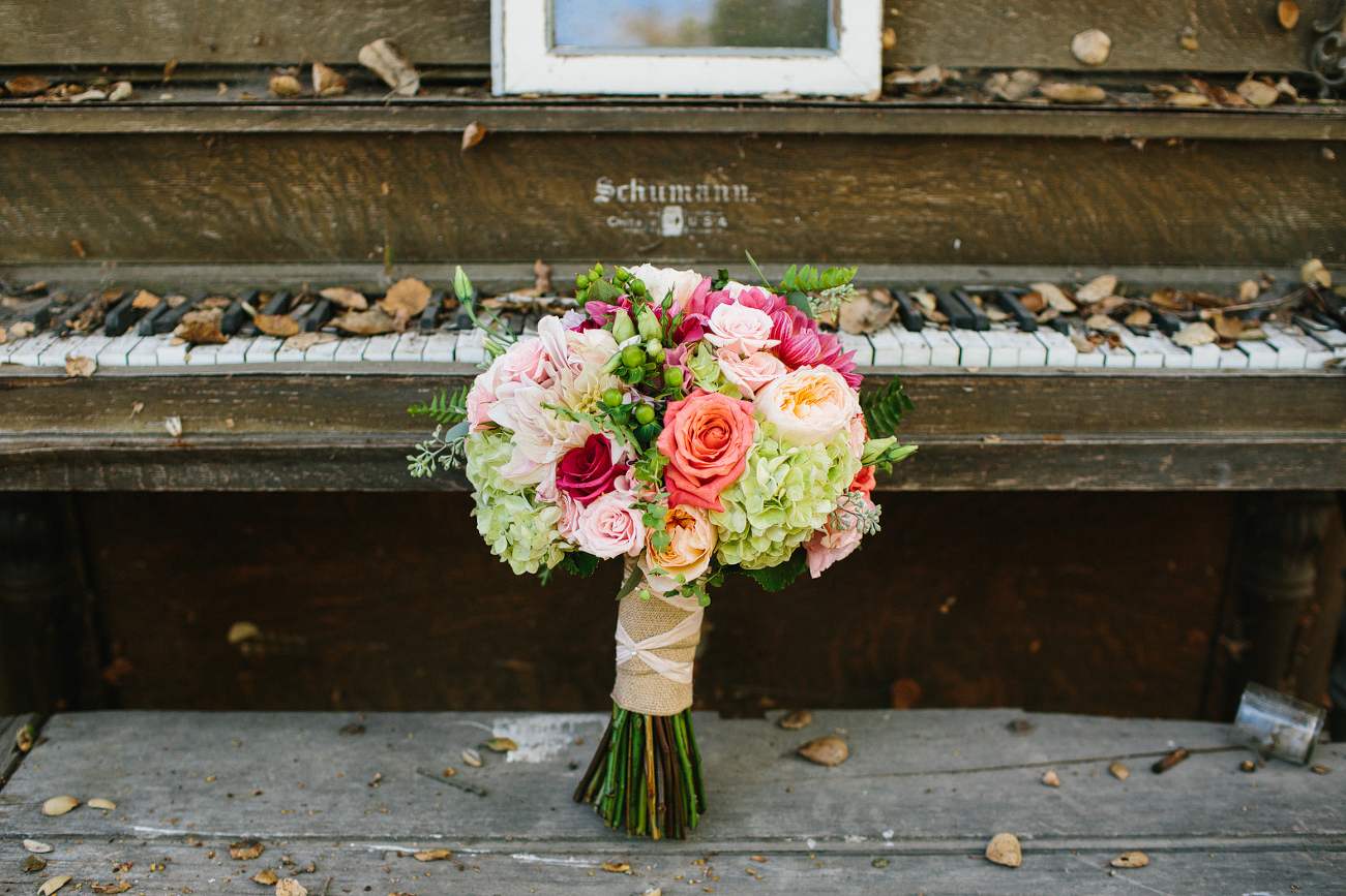 Bridal bouquet on rustic old piano. 