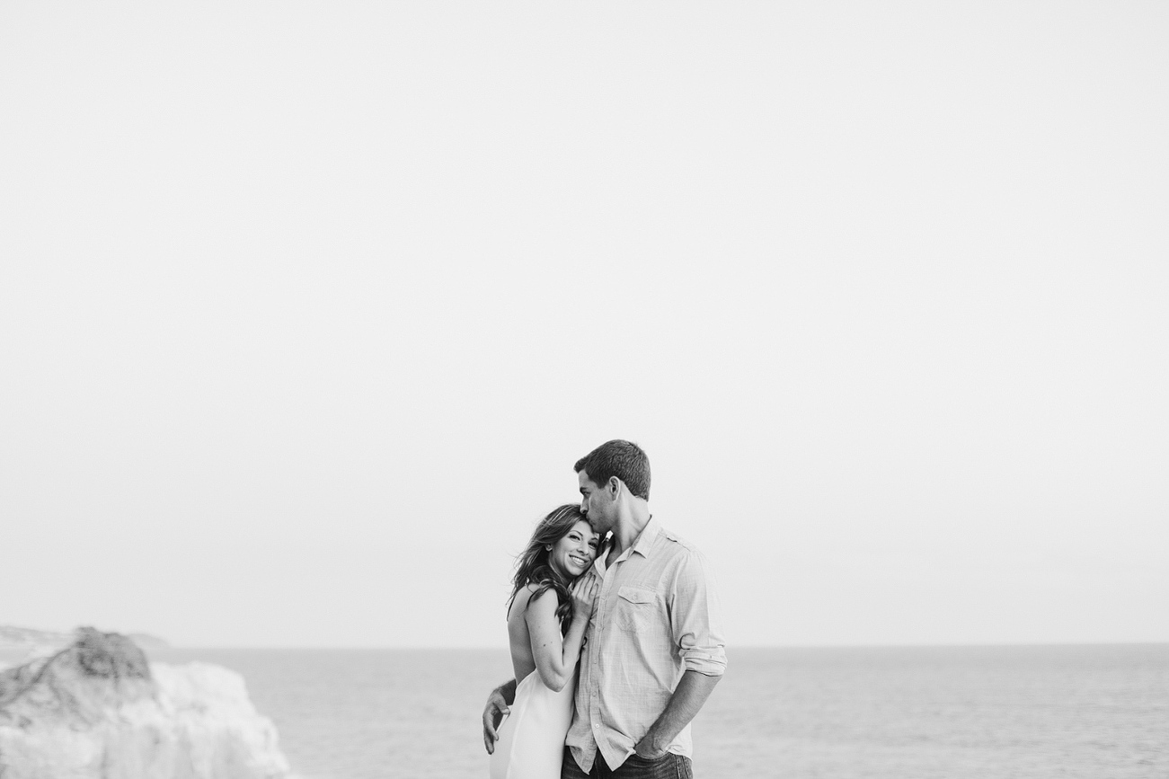 A sweet black and white photo of Sara and Sam on the cliffside. 