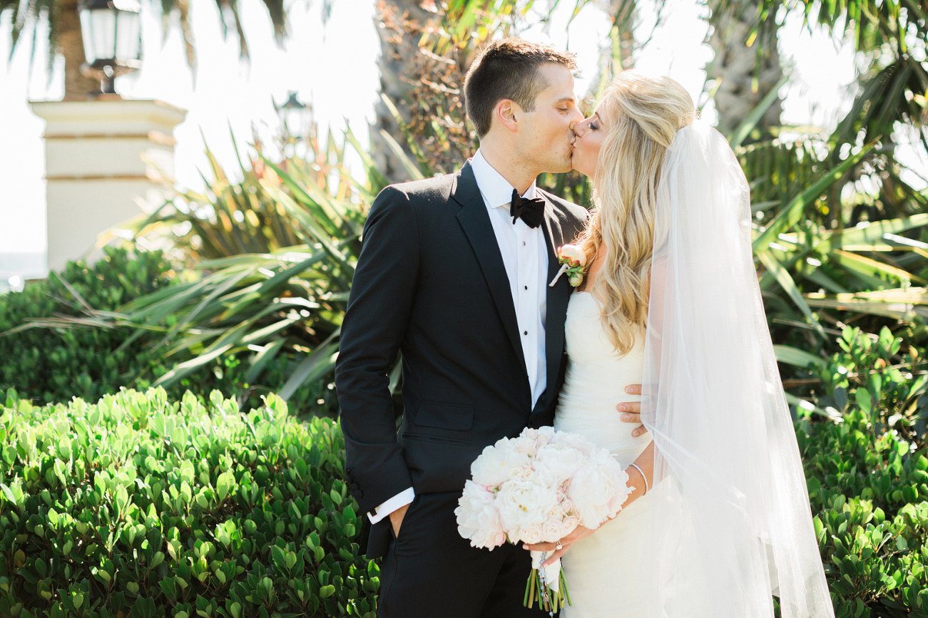 The bride and groom sharing a kiss. 