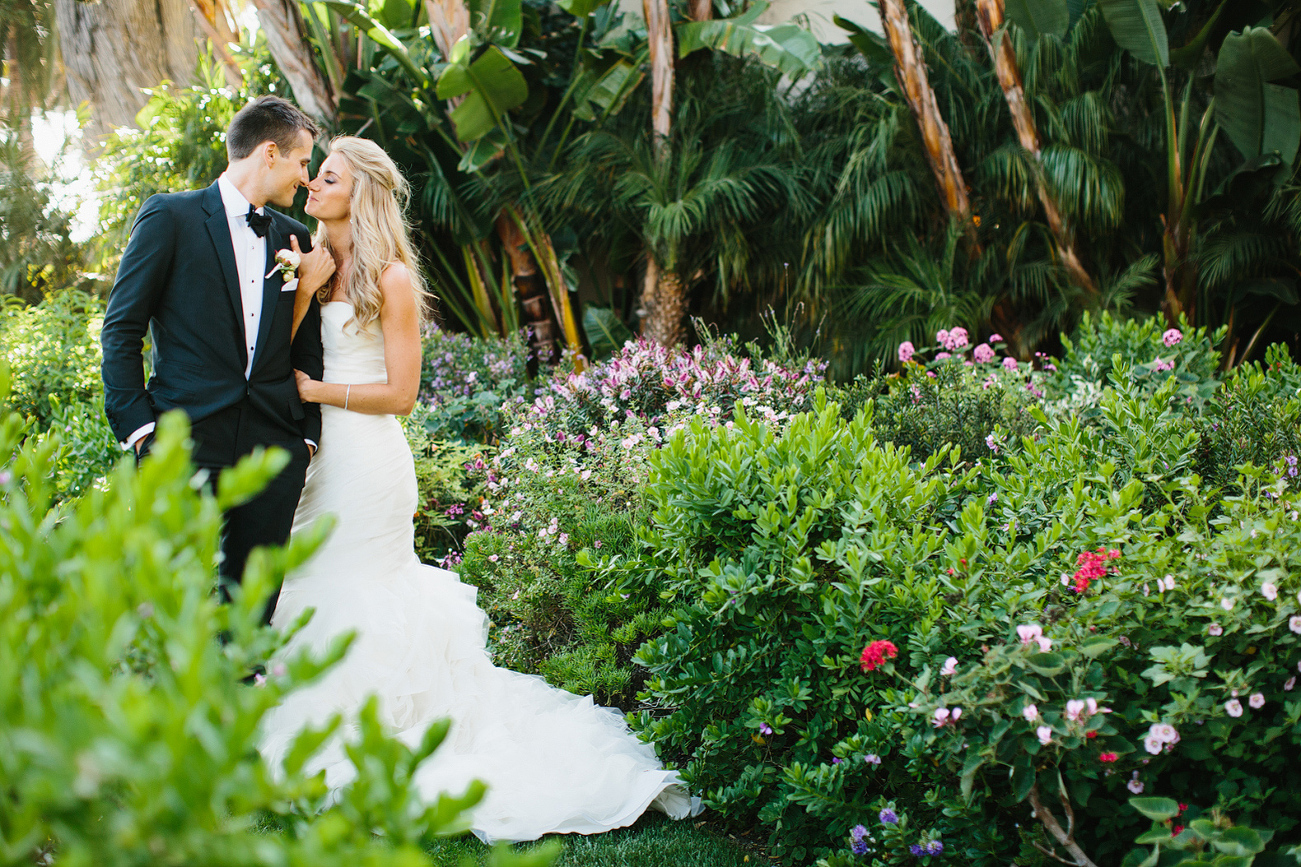 The bride and groom in a garden area. 