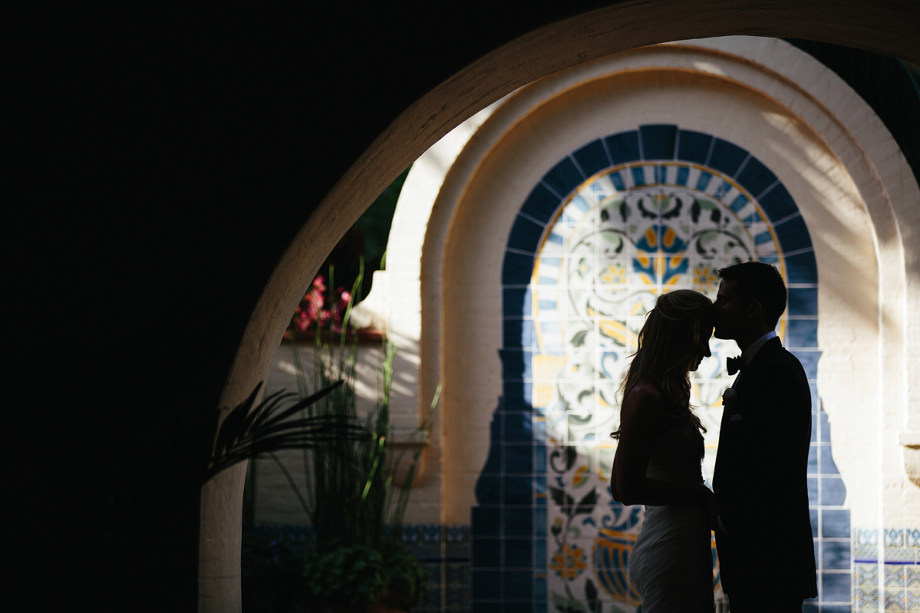 Jaclyn and Nick under an arch. 