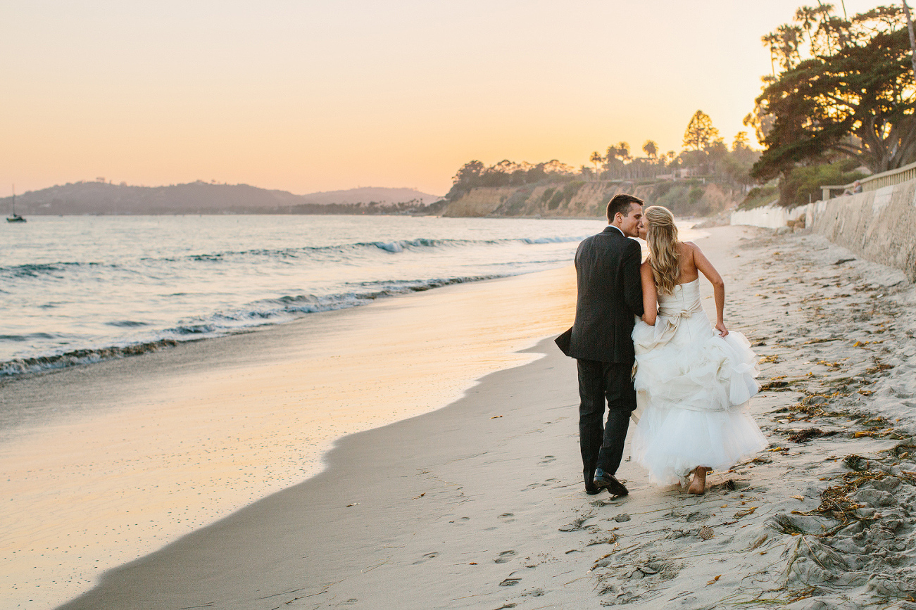The couple walking on the beach in Santa Barbara. 