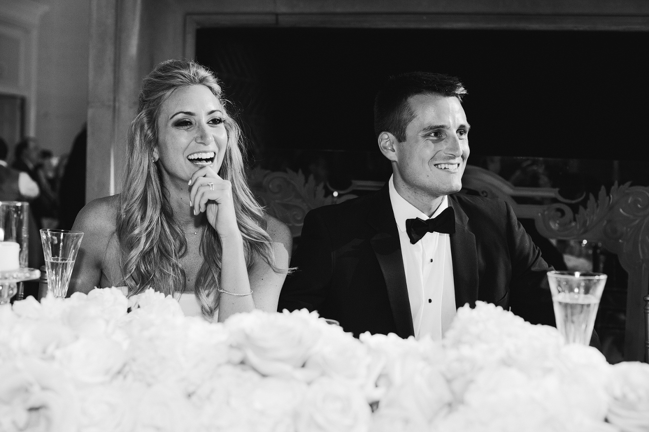 A cute shot of the couple during toasts. 