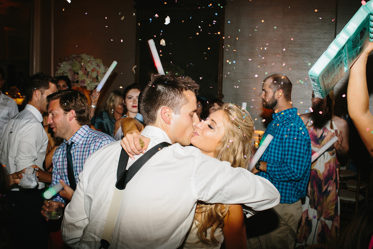 Confetti falling on the bride and groom. 