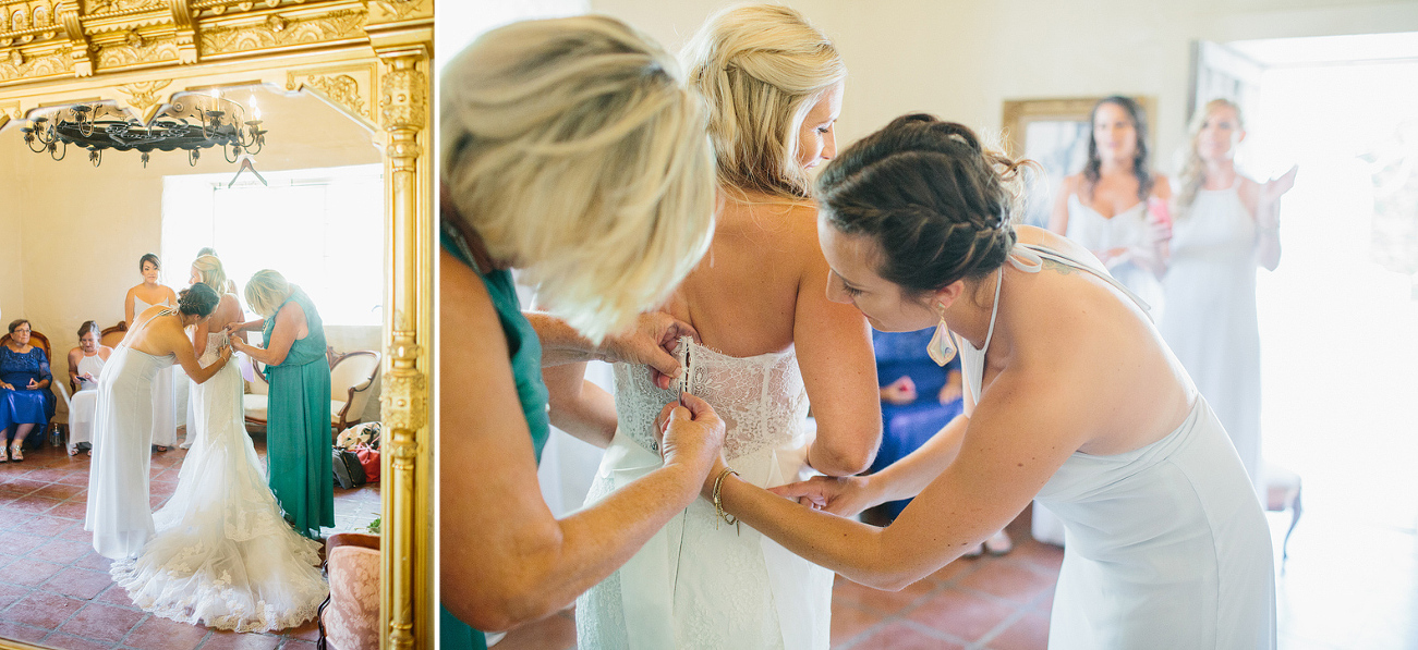 The bridesmaids helping Liz get in her dress. 