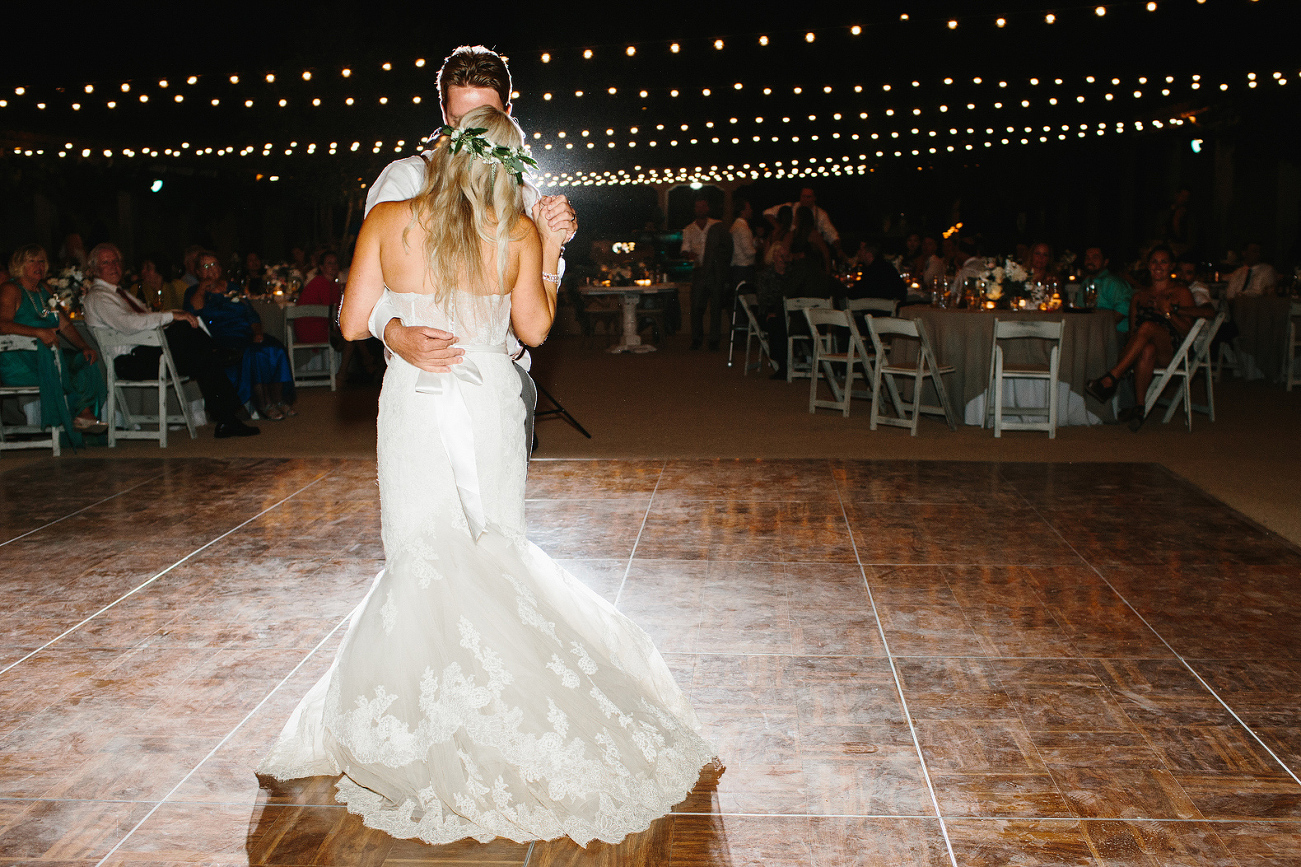 A photo of the back of the bride