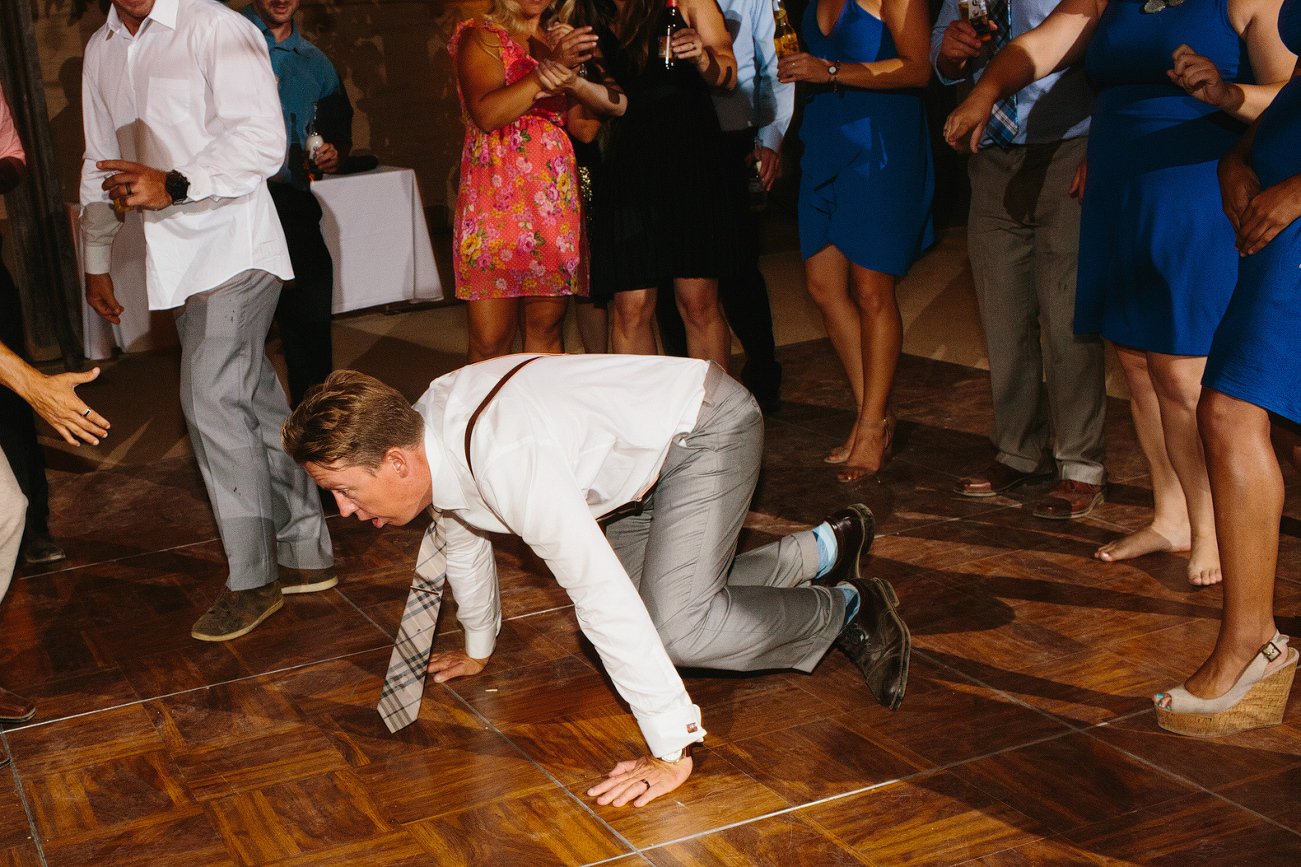 The groom break dancing. 