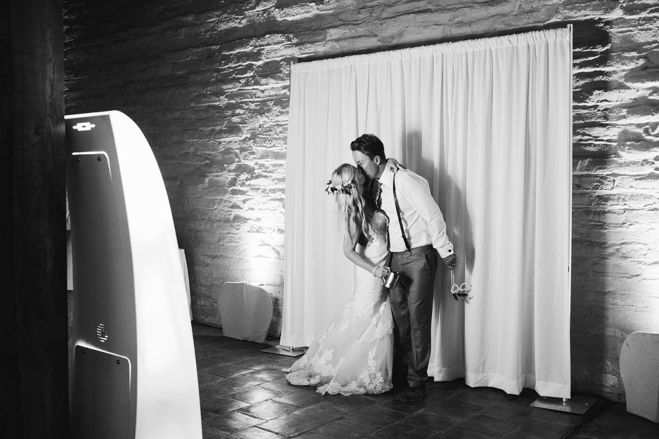 The bride and groom using the photobooth. 