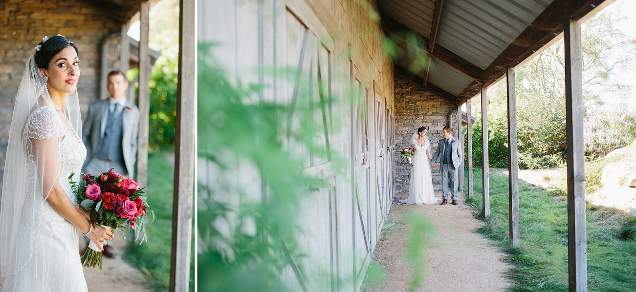 The couple walking on the side of the barn. 